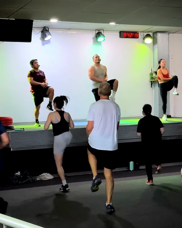 Sherwin teaching a Les Mills group fitness class on stage