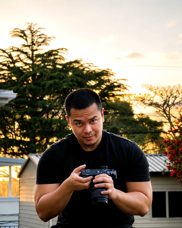 Sherwin holding his camera at sunset