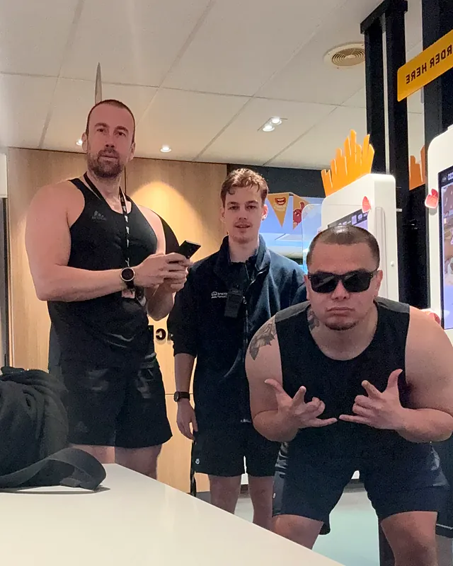 Sherwin being playful with two workmates after a gym session